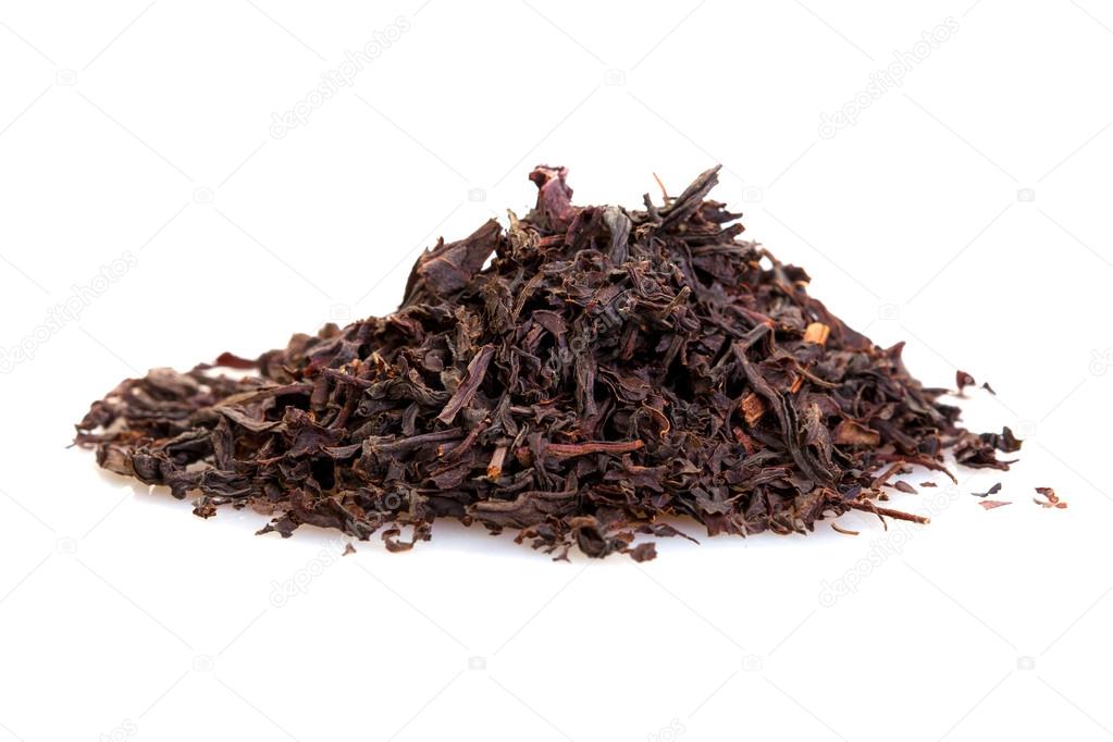 dry black tea leaves isolated on white