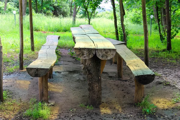 Table and benches made of logs are in the park — Stock Photo, Image