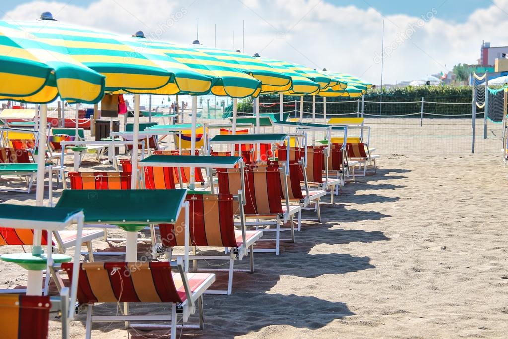 Sunbeds and umbrellas on the beach in the resort town Bellaria I