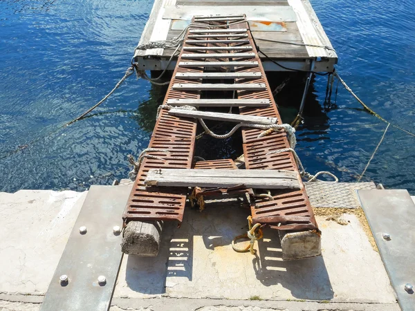 Old decking on the docks in the Sicilian port — Stock Photo, Image