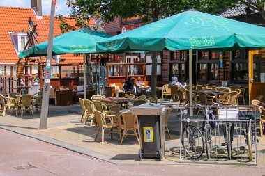 People sitting in a street cafe in Zandvoort, the Netherlands.