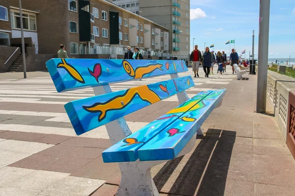 Painted colourful bench on the waterfront of North sea in Zandvo — Stok fotoğraf