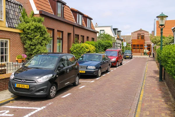 Parked autos on picturesque street in Zandvoort, the Netherlands