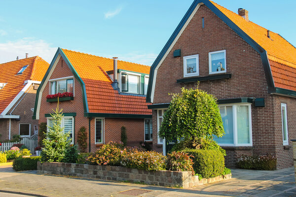 Picturesque residential houses in small Dutch town Zwanenburg, t