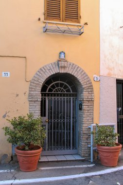 Facade of old building  in the center of Rimini, Italy