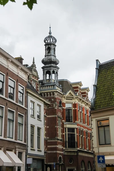 Old tower with a spire in the historic center of Haarlem, the Ne — Stock Photo, Image