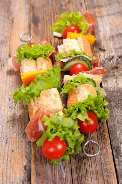 Ham sandwiches on skewers — Stock Photo, Image