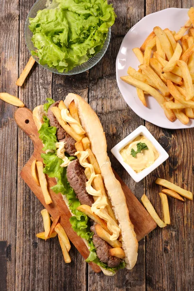 Sandwich with beef and french fries — Stock Photo, Image