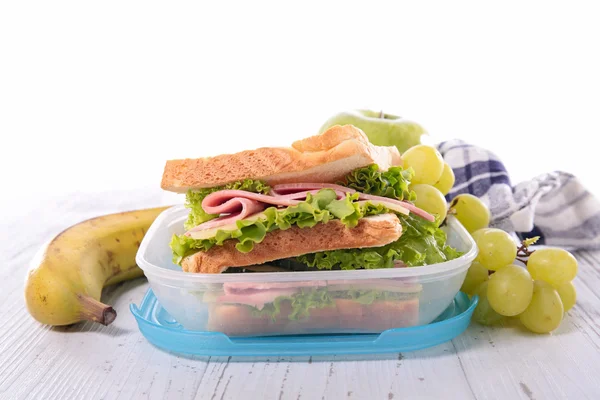 Sandwich, lunch box and fruits — Stock Photo, Image