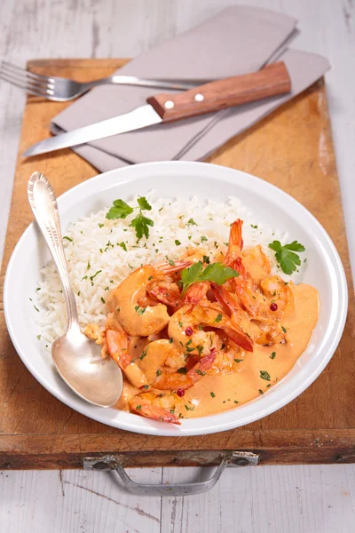 Shrimps with curry sauce and rice — Stock Photo, Image