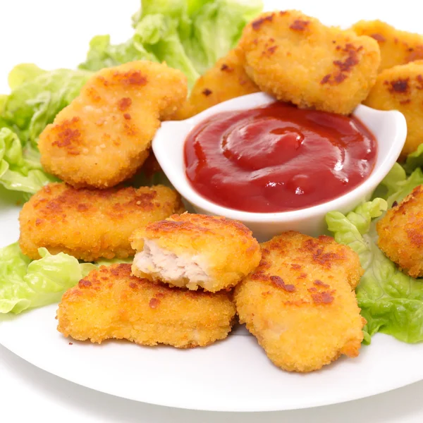 Fried chicken nuggets and salad — Stock Photo, Image
