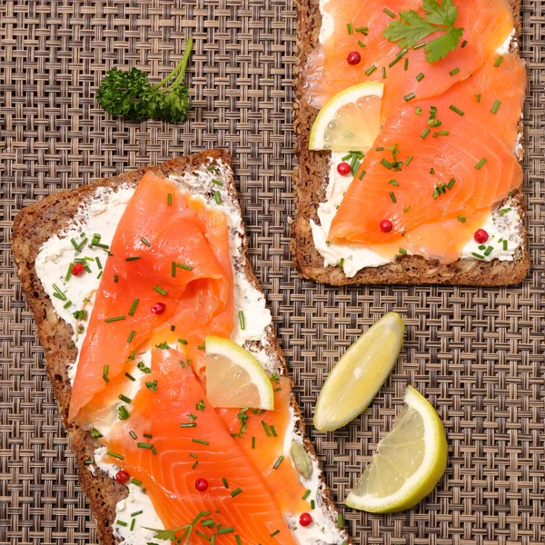 Toasts with cheese and salmon — Stock Photo, Image