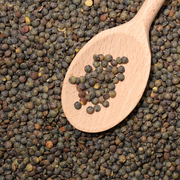 Lentils grains with spoon — Stock Photo, Image