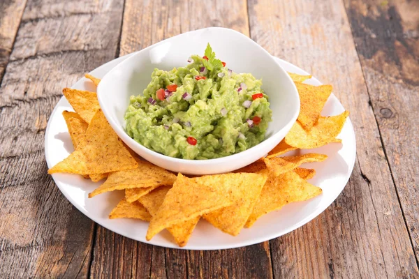 Guacamole sauce dip with nachos — Stock Photo, Image