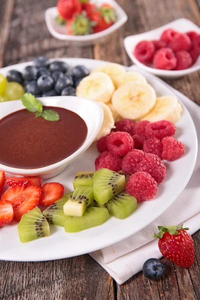 Fruits and chocolate dip — Stock Photo, Image