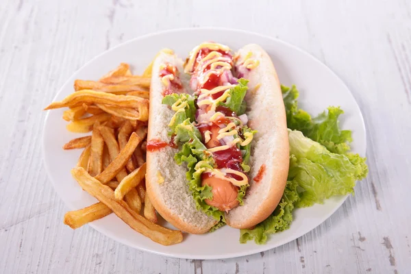 Hot dog with french fries — Stock Photo, Image