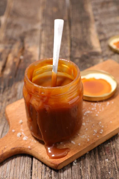 Caramel dessert in jar — Stock Photo, Image