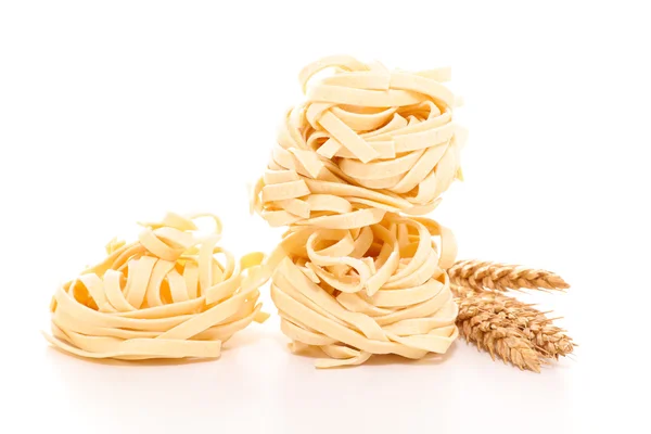 Raw tagliatelle pasta — Stock Photo, Image