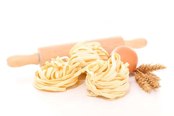 Raw tagliatelle pasta — Stock Photo, Image