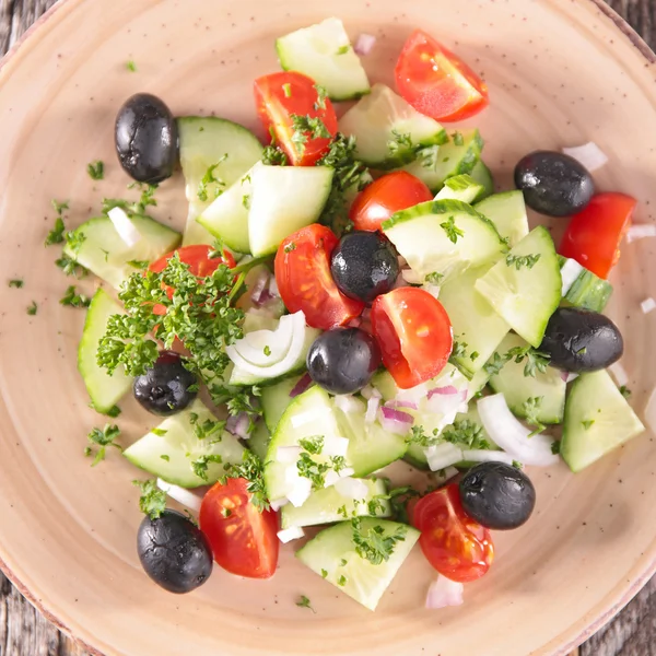 Cucumber, tomatoes, olives salad — Stock Photo, Image