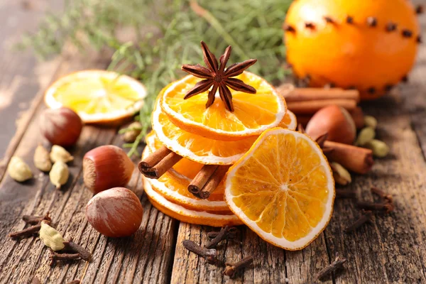 Christmas spices and dried oranges — Stock Photo, Image