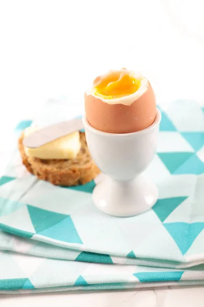 soft boiled egg and toast with butter