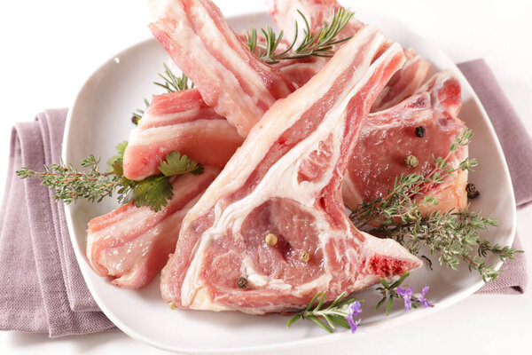 raw lamb chop with spices