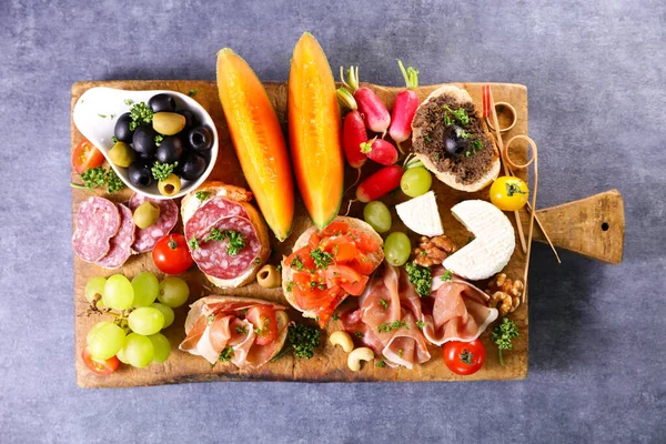 stock image antipasto- buffet food on wooden board