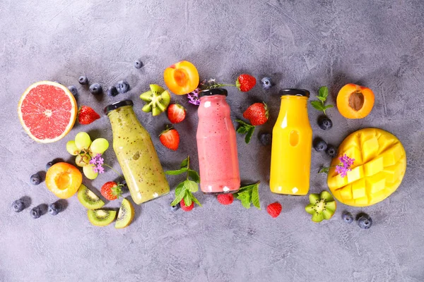 fruit juice- smoothie in bottle and fruits