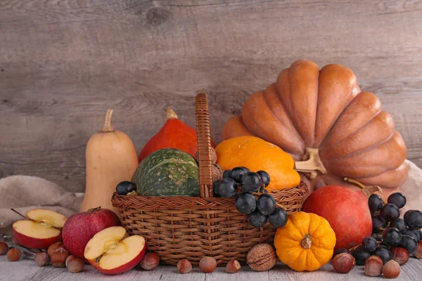 Pumpkins apples and nuts — Stock Photo, Image