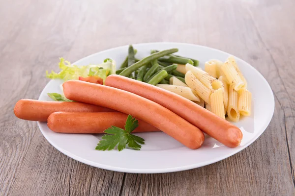 Sausages with pasta — Stock Photo, Image
