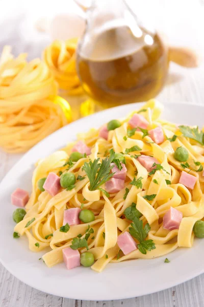 Pasta with pea and ham — Stock Photo, Image