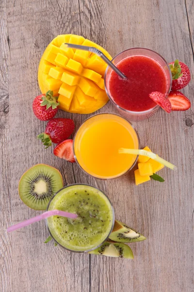 Fruit juice on wooden table