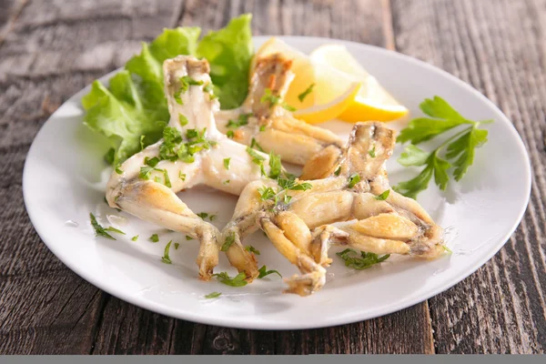 Frog leg cooked with butter — Stock Photo, Image
