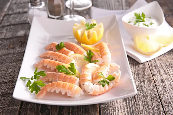 Dish of langoustine with lemon — Stock Photo, Image