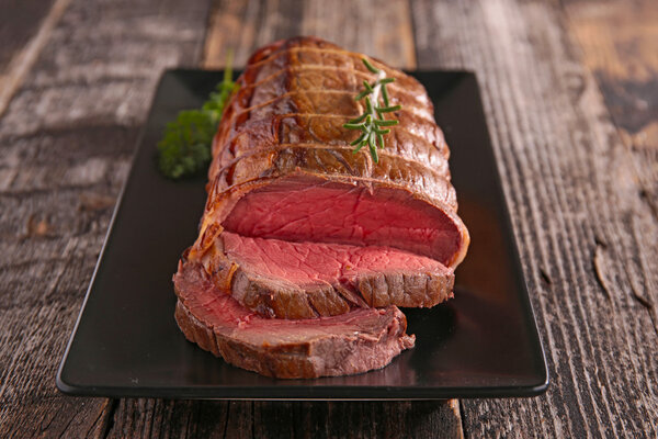 Roast beef in plate close up view