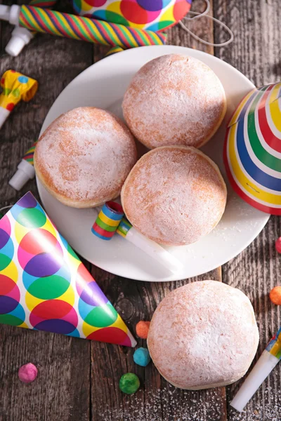 Donuts and carnival decoration — Stock Photo, Image