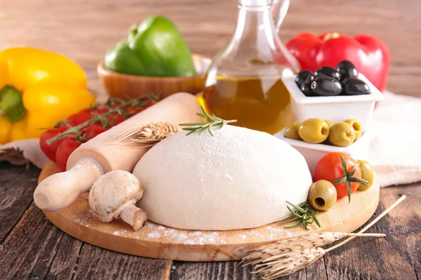 Pizza ingredients on wooden table — Stock Photo, Image