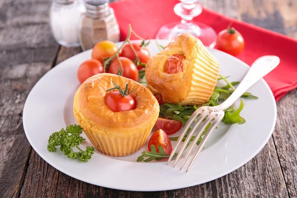 Tomato muffin over the plate — Stock Photo, Image