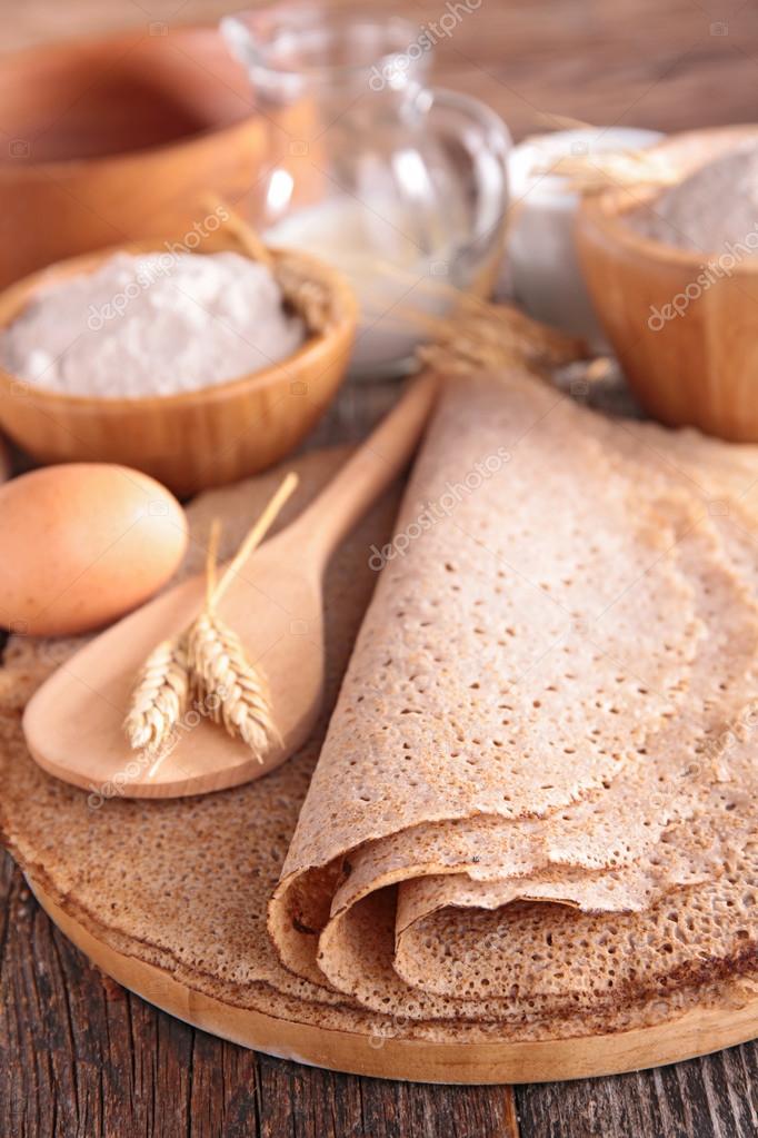 Buckwheat crepes and ingredients — Stock Photo © studioM 63381217