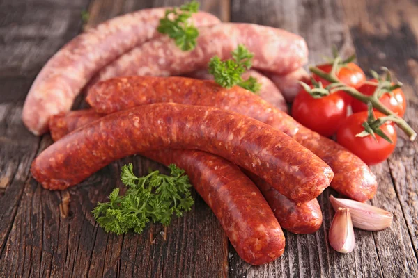 Raw sausages with parsley — Stock Photo, Image