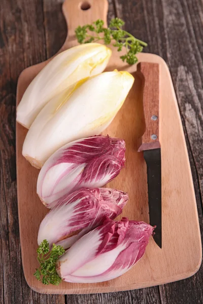 Fresh chicory on board — Stock Photo, Image