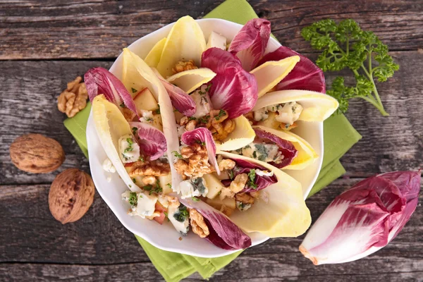 Chicory salad with cheese and walnut — Stock Photo, Image