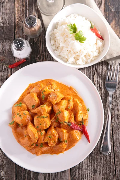 Chicken with spicy sauce and rice — Stock Photo, Image
