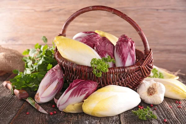 Basket with raw chicory — Stock Photo, Image