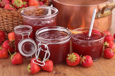 Strawberry jam in glass jars clipart