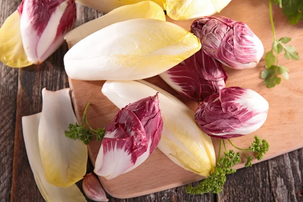 Fresh chicory on board — Stock Photo, Image