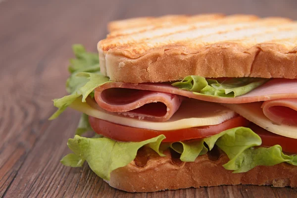 Sandwich with ham and salad — Stock Photo, Image