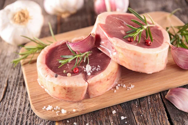 Raw meat on woode background — Stock Photo, Image