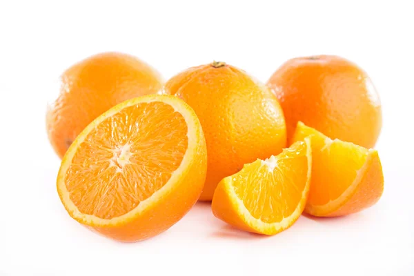 Juicy sliced and whole Oranges — Stock Photo, Image